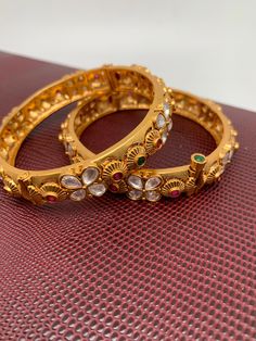 Kundan Red Green Stone Matte Finish Bangles Festive Red Jeweled Bangle, Red Jeweled Bangle As A Gift, Red Jeweled Bangle For Gift, Red Jeweled Bracelets For Festivals, Multicolor Stone Bangle For Gift, Multicolor Stone Bangle As Gift, Green Stone, Hand Coloring, Indian Jewelry