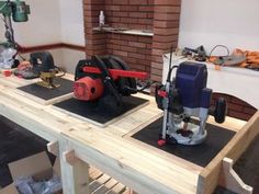 two pieces of wood are being worked on with power tools and sanding equipment in the background