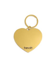 a gold heart shaped keychai with the word bando on it's side