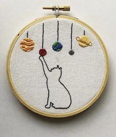 an embroidery kit with thread, spools and scissors