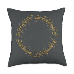 the lord's ring pillow is shown in grey and gold on a white background