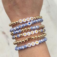 🔹 Design the custom name bracelet that you have always wanted! These beaded word bracelets stacking can be personalized so you can get exactly what you want. 🔹They are made with 6mm blue flower porcelain/ceramic beads, 6mm 18k gold plated beads, 7mm white acrylic beads with gold letters and then strung together with a strong double-strung elastic cord. 🔹Please add each bracelet style separately to your cart. They will be sent to you as a stack. If you want all six bracelets, please choose the option for all six bracelets, otherwise you will receive the single styles that you purchased. 🔹Each custom beaded bracelet stack is packed in a gift box wrapped in organza ribbon and a handwritten message can also be included. It makes the perfect gift for yourself or for Christmas, a baby shower Personalized Beaded Bracelets As Gifts, Adjustable Name Beaded Bracelets With Round Beads, Adjustable Name Beaded Bracelet With Round Beads, Adjustable Name Beaded Bracelets, Personalized Blue Friendship Bracelets, Friendship Beaded Name Bracelet With Round Beads, Friendship Name Beaded Bracelets With Round Beads, Friendship Beaded Bracelet With Name, Custom Name Blue Bracelets With Round Beads