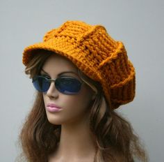 a mannequin wearing sunglasses and a knitted hat on top of a head