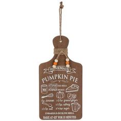 a wooden pumpkin pie sign hanging from a string