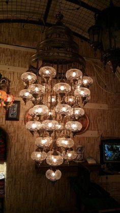 a chandelier hanging from the ceiling in a room