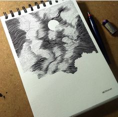 an apple pencil drawing on top of a notebook