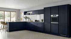 a kitchen with blue cabinets and white counter tops