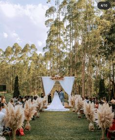 an outdoor wedding ceremony in the woods