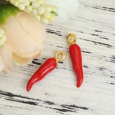 These adorable gold -plated enamel charms are made from zinc alloy metal and enamel.  They are lead and nickel free. They're perfect for crafting necklaces, bracelets, earrings, bookmarks, key chains and more!  ♥ Gold Plated Red Chili Pepper Charms(3D) ♥ Material: Zinc Alloy Metal, Enamel  ♥ Overall Size: 20 x 4mm  ♥ Includes: 2 or Bulk 10 pieces  We ship from North Carolina via USPS with tracking included. Tracking is included with all orders. Get free shipping on orders over $35!  Don't forget to favorite us too, we add items daily. Thank you... craft on. Red Novelty Jewelry For Gift, Red Novelty Jewelry As Gift, Novelty Gold Metal Jewelry, Handmade Red Craft Supplies For Gifts, Novelty Red Jewelry For Gifts, Novelty Red Jewelry Gift, Personalized Red Dangle Jewelry, Gold Charms Nickel Free For Gift Making, Red Charms For Valentine's Day Gift