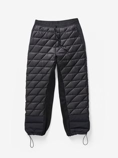 An easy sweatpant silhouette optimized for technical ultralight warmth and supreme comfort. Made from a featherlight 7D Japanese nylon insulated with 750 fill traceable down. Featuring a custom knit waistband and Polartec Powerstretch Pro® gusset for breathable flexibility when you're on the move. Abrasion resistant overlays at seat and hem for extra durability. A technical solution for cold city streets and outdoor excursions. Model is 6' 1", 31” Waist, 33” Chest and wears a size M. Size Waist Functional Black Pants For Winter Sports, Sporty Sweatpants For Outdoor Winter Activities, Functional Black Bottoms For Winter Sports, Winter Nylon Parachute Pants For Streetwear, Outdoor Nylon Sweatpants Sportswear, Functional Nylon Parachute Pants For Winter, Functional Black Sweatpants For Outdoor Activities, Nylon Sportswear Sweatpants For Outdoor, Functional Parachute Pants For Winter Outdoor Activities