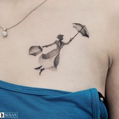 a woman with an umbrella tattoo on her chest