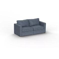 a blue couch sitting on top of a white floor