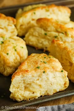 some biscuits are sitting on a baking sheet