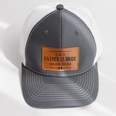 Introducing our Personalized Leather Patch Hat, a heartfelt and memorable gift for the father of the bride, presented by his beloved daughter on her wedding day. Crafted with precision and care, this hat is more than just a gift; it's a symbol of the cherished moments shared between a father and his daughter. Imagine the emotion and gratitude on the father of the bride's face as he receives this thoughtful and personalized gift from his daughter on her wedding day, knowing that their special relationship is honored and celebrated. Make this wedding unforgettable with a gift that captures the love and appreciation between a daughter and her father, bringing joy and happiness to their hearts with this unique hat. PRODUCT DETAILS: Material: Crafted from a high-quality blend of 60% Cotton and Classic Curved Brim Hat As A Gift, Classic Curved Brim Hat, Adjustable Hats As Father's Day Gifts, Father's Day White Snapback Trucker Hat, White Snapback Trucker Hat For Father's Day, Personalized White Wedding Hat, Personalized Adjustable Hats For Wedding, Wedding Snapback Trucker Hat, Adjustable Trucker Hat For Wedding