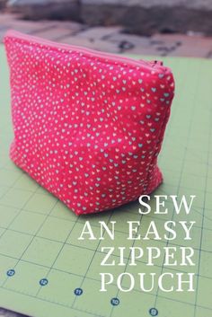 a zipper pouch sitting on top of a cutting board with the words sew an easy zipper pouch