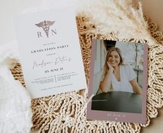 a card with a photo of a woman on it next to a white and pink blanket