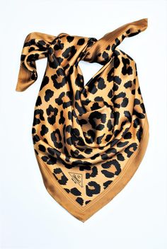 The Cheetah pure silk scarf is inspired by designer's vision of the beautiful World. This scarf is hand drawn, reworked digitally and custom printed on 100% mulberry silk charmeuse.  Alesia C. creations aim to reflect on the beauty in the world and embody the simple pleasures of life. All our scarves are handcrafted from the finest pure silk and luxuriously hand-roll hemmed. Elevate your accessories the classy way with pure silk scarf that goes with all your outfits or use it as a home accent décor or framed art. Wrap the scarf around neck, wrist, head, pony tail or attach to your purse. The styling options are endless. This scarf is perfect to accessorize with any of Alesia C. Scarf Charm-Rings to hold your scarf in place. Silk scarves make sophisticated accessories for casual or business Pure Silk Scarf, Purple Gift, Hand Roll, Timeless Gifts, Charm Rings, Silk Charmeuse, Rolled Hem, Gift For Wife, Simple Pleasures