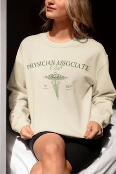 This Gender-Neutral Adult Sweatshirts item is sold by ModMerchStudios. Ships from San Jose, CA. Listed on Mar 6, 2024 Classic Crew Neck Tops With Letter Print, Physician Associate, Physician Assistant Student, Club Luxury, Grad Shirts, Pa School, Luxury Green, Green Crewneck, Physician Assistant