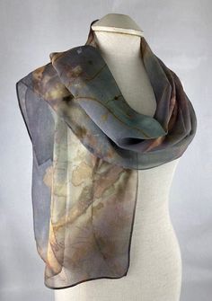 Sometimes I surprise myself at what happens during the dying process! The mysterious colors of this scarf are extraordinary! Hand dyed using real Peony leaves and metal, this organic look is sure to make a statement. A subtle mixture of black, maroon, green, purple with a dash of pink make this scarf a beauty! Lightweight, silk chiffon is a delicate must have for your wardrobe. Approximately 14" x 72". Dry clean only Free Shipping in the USA! I so appreciate your support and am always available Peony Leaves, Eco Printing, Hand Dyed Silk, Silk Dyeing, Printed Silk, Silk Chiffon, Silk Printing, Hand Dyeing, Chiffon