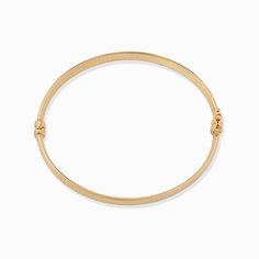 Inspired by the Grand Prix of Monaco, our Moto Bangle exudes style. Featuring a wide, flattened solid gold tube, it is hand etched with a vintage design that offers a classic yet modern look. The Finer Points: Metal: 14 Karat Yellow Gold Dimensions: 8mm Wide Tube, 60mm Diameter Weight: 7.4 Grams Construction: Latch with Figure Eight Closure Origin: Crafted in Arezzo, Italy Classic Gold-tone Bangle For Everyday, Classic Bracelets With Decorative Band As Gift, Elegant Gold Band Bangle, Classic Gold Band Bracelet, Classic 14k Gold Hallmarked Cuff Bracelet, Classic Formal Bracelets With Decorative Band, Classic Bracelets With Decorative Band For Formal Occasions, Yellow Gold Bangle Bracelet With Decorative Band, Yellow Gold Bangle With Decorative Band