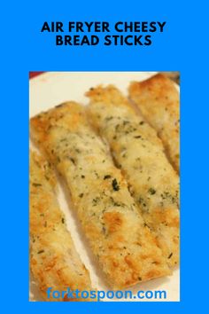 four cheesy bread sticks on a plate with text overlay that reads air fryer cheesy bread sticks