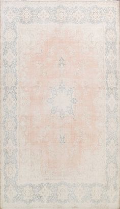 an antique rug with blue and pink colors