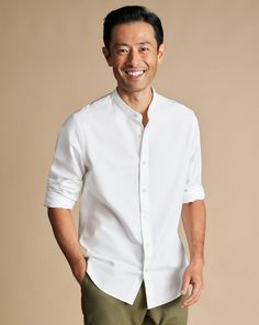 87% cotton, 13% linen, Available in slim fit, Naturally breathable, Mid-weight Oxford weave, Collarless, Split yoke for optimal fit and comfort, Back pleats for ease of movement, Mitred two-button cuff, Machine washable - Collarless Cotton Linen Shirt - White | Men's Charles Tyrwhitt Collarless Casual Shirt - White Single Cuff Size Large Cotton/Linen Collarless Shirt Men, Best White Shirt, Charles Tyrwhitt Shirt, Africa Trip, Black Suit Wedding, Shirt Wrinkles, Collarless Shirt, Business Casual Shirts, Grey Polo Shirt