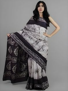 This beautiful handmade Batik print saree is a celebration of traditional Indian craftsmanship. Made from pure cotton, the saree is soft, breathable, and comfortable, perfect for all-day wear. With a length of 6.4 meters, it drapes elegantly, showcasing intricate Batik designs that are both timeless and stylish. The accompanying blouse piece measures 0.90 meters, allowing for a perfect fit. Ideal for both casual and festive occasions, this saree adds a touch of grace and sophistication to any wardrobe. - **Material Pure Cotton for ultimate comfort and breathability. - **Design Traditional Batik print, showcasing intricate handmade designs. - **Saree Length 6.4 meters, providing ample fabric for elegant draping. - **Blouse Piece Includes a 0.90-meter blouse piece, customizable for a perfect Festive Cotton Pre-draped Saree With Printed Border, Traditional Diwali Saree With Batik Print, Traditional Batik Print Saree For Diwali, Diwali Batik Print Saree In Traditional Drape, Bohemian Saree With Batik Print, Traditional Drape Saree With Batik Print For Diwali, Bohemian Batik Print Saree For Diwali, Bohemian Batik Print Saree With Traditional Drape, Bohemian Batik Print Saree