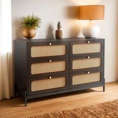 an image of a living room setting with pineapples on the top of the dresser