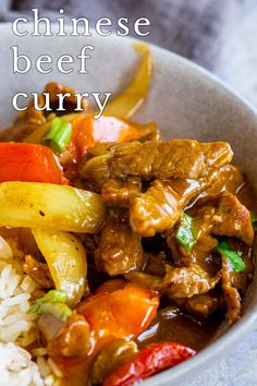 a bowl filled with beef and vegetables on top of rice