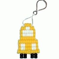 a yellow car shaped ornament hanging from a key chain on a white background