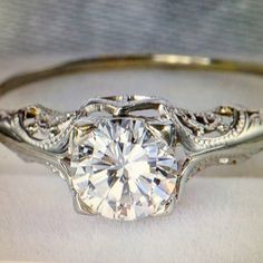 a diamond ring with filigrees on it