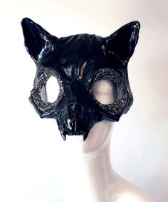 Our exquisite Women's Cat Skull Mask in Black, designed to add a touch of feline magic to your Halloween costume or masquerade festivities! The mesmerizing crystal-lined eyes capture the light and add a sparkle to your look. Crafted to combine the mystical elements of a cat and the haunting beauty of a skull, this mask exudes a Halloween allure like no other. 


Age Group/Gender - Adult/Unisex

Size/Type - One size fits all adults

Mask Color - White

Filigree Color - Purple

Mask Material - Lea Cat Skull Mask, Animal Masquerade Mask, The Call Of The Void, Cat Masquerade Mask, Black Cat Mask, Call Of The Void, Black Masquerade, Purple Mask, Mystical Elements