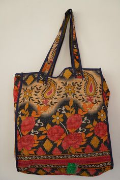 an embroidered bag hanging on the wall