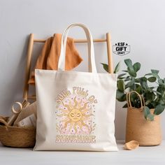 "Soul Full Of Sunshine Canvas Tote Bag, Sunshine Tote, Cute Retro Bag, Shopping Bag, Summer Tote Bag, Sunset Totes, Summer Gifts, Market Bag Personalized tote bags are perfect for yourself, Your Company, or as a gift! These are also the ideal bride's, Bridal Shower, Baby Shower, Birthday Party, gift, or proposal gift. PRODUCT *Measurements15\"L x 16\"H *12 oz./yd² (US), 20 oz (CA), 100% heavy cotton canvas *20\" canvas webbed handles * 9\" handle drop *Made from Heavy duty cotton canvas fabric *DTF printing for the best color quality * Bulk discounts are available upon request. *Put N/A In the personalization Box For  Blank Tote Bag  Check the Tote bag Color And Text Color Chart In display Pictures Before Order HOW TO ORDER    *Put N/A In the personalization Box For  Blank Tote Bag   *Make Beige Shoulder Beach Bag As Gift, Cream Large Capacity Bag As Gift, Large Capacity Cream Bag As A Gift, Beige Canvas Shoulder Bag As Gift, Beige Shoulder Beach Bag, Cream Tote Bag As A Gift, Cream Rectangular Canvas Bag For Gift, Cream Rectangular Canvas Bag Gift, Large Capacity Canvas Pouch Bag As Gift