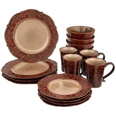 a set of brown dinnerware with matching cups and saucers