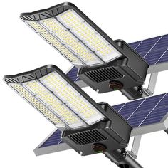 two solar powered street lights are shown