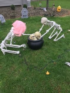 halloween decorations in the yard with skeletons and skeleton heads