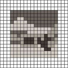 a cross stitch pattern with a skull in the middle and black squares around it, all on one side