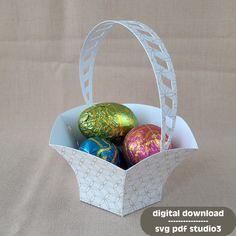 an easter basket filled with chocolate eggs on top of a table