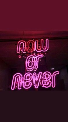 a neon sign that says now or never