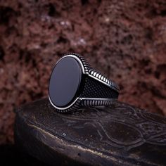 Oval Onyx Men Ring. Handmade in 925 sterling silver with Onyx stone. On the ring, oval Onyx stone settled. The sides are micro-detailed. The dimensions of the stone are 18 mm x 13 mm. The average weight of the Onyx Oval Silver Men Ring is 10 gr. (depends on your ring size). The back side of the stone is open to touch your skin. Stone Type: Onyx - Black Aqeeq Stone Color: Black Stone Dimensions: 18 mm x 13 mm Stone Shape: Oval, Flat Average Weight: 10 gr. Made in Istanbul, Turkey. Need 3-6 days t Black Onyx Ring Men, Men Ring Silver, Silver For Men, Onyx Ring Men, Mens Gemstone Rings, Silver Men Ring, Silver Handmade Jewelry, Ring Men, Black Onyx Ring