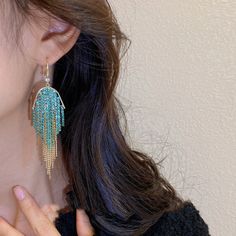 Unveil the enchantment of the LOVCIA Turquoise Cascade Beaded Waterfall Fringe Dangle Earrings for Women, a truly mesmerizing piece of jewelry that embodies elegance and charm. These earrings are a perfect blend of modern design and timeless beauty, crafted to make a statement wherever you go. Key Features Exquisite Design: The U-shaped diamond tassel ear hook showcases a cascading waterfall of turquoise beads, creating a stunning fringe effect that sways gracefully with every move. Premium Mate Turquoise Dangle Chandelier Earrings For Party, Turquoise Dangle Tassel Earrings For Party, Elegant Turquoise Tassel Earrings With Dangling Beads, Elegant Turquoise Tassel Earrings For Gifts, Cascading Waterfall, Black Friday Jewelry, Tassel Earing, Mens Stainless Steel Rings, Natural Stone Bracelets