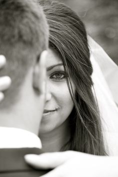 a bride and groom looking at each other