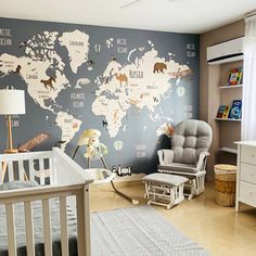 a baby's room with a world map on the wall