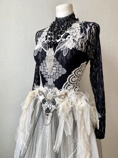 a black and white dress with feathers on it