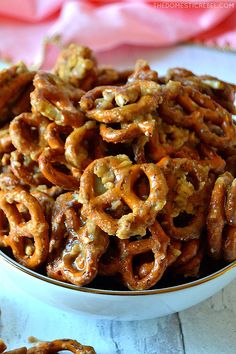 a bowl filled with pretzels on top of a table