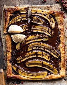 a chocolate and banana tart with ice cream on top