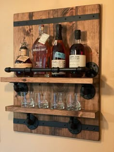 a wooden shelf with bottles and glasses on it