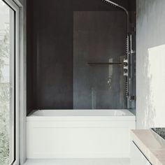 a white bath tub sitting next to a window